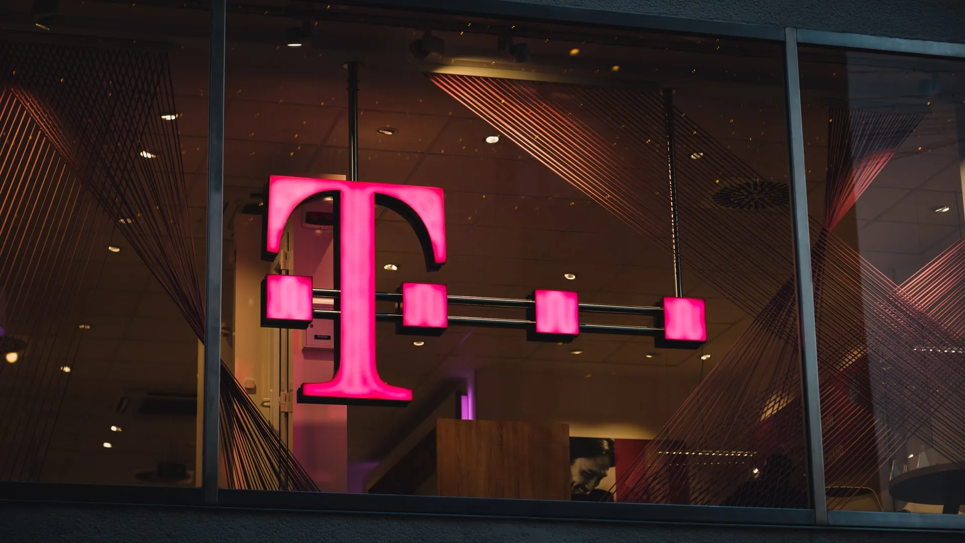 photo of t-mobile logo Photo by Mika Baumeister on Unsplash