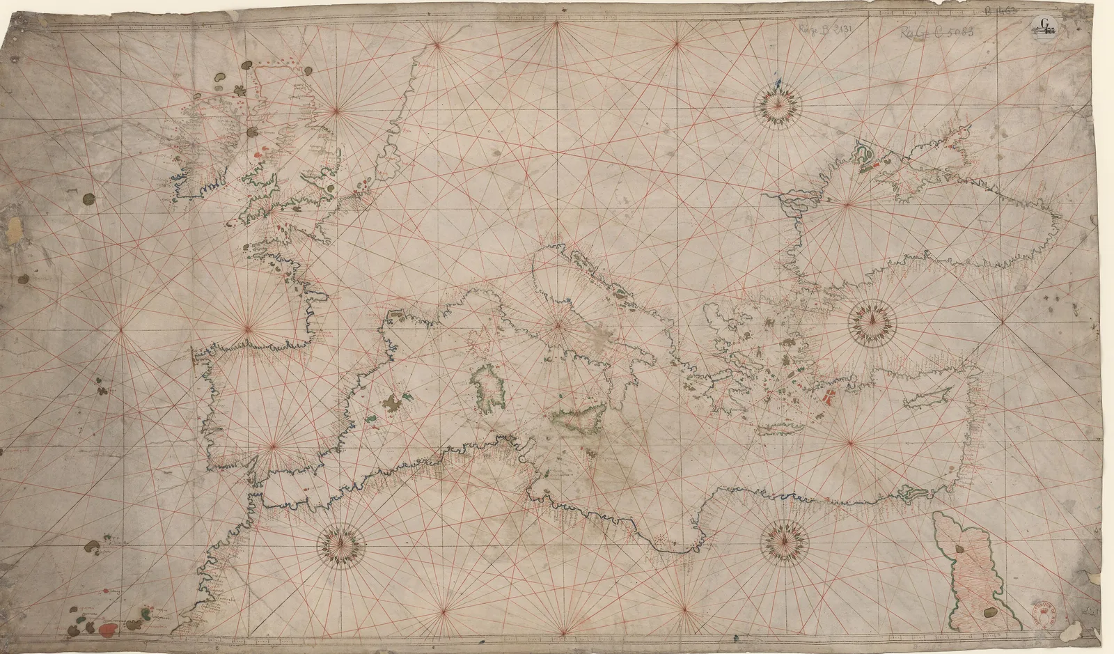 Portolan chart of the Mediterranean and Black Sea by Battista Agnese, 1550: coastlines drawn on parchment, densely annotated with place names, under a network of rhumb lines radiating from compass roses