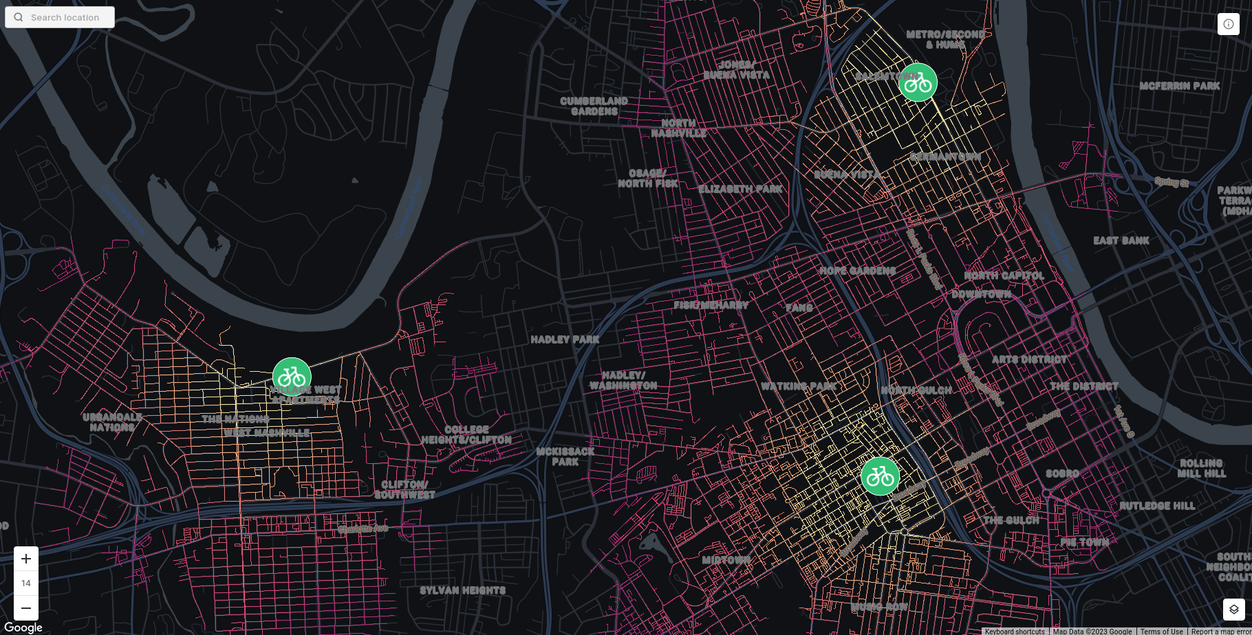 A map showing the output of the ROUTING_ISOLINES function. There are 3 points indicating micromobility hubs with a bike icon on them. The road lines start of bright yellow near these points, and get darker as it takes longer to reach them by bike.